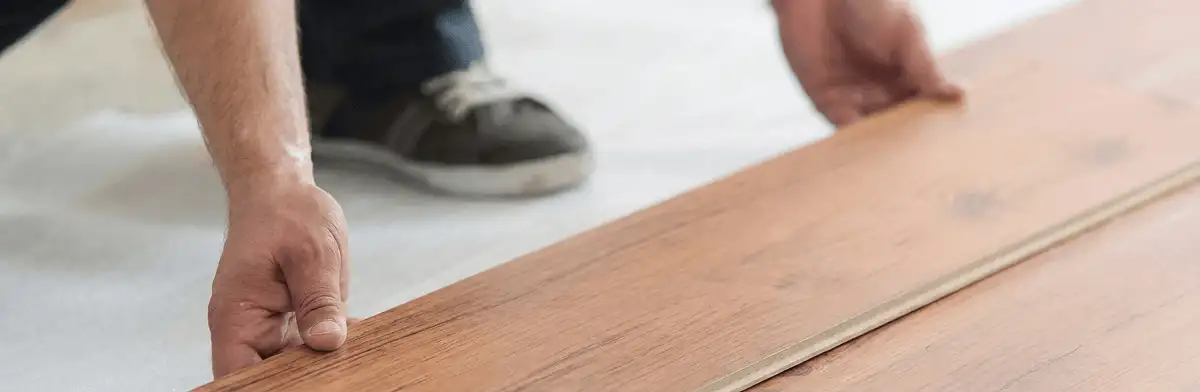 A professional installing laminate flooring in San Jose, CA