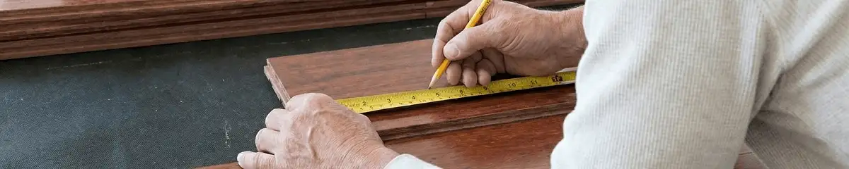 A professional installing wood flooring in San Jose, CA